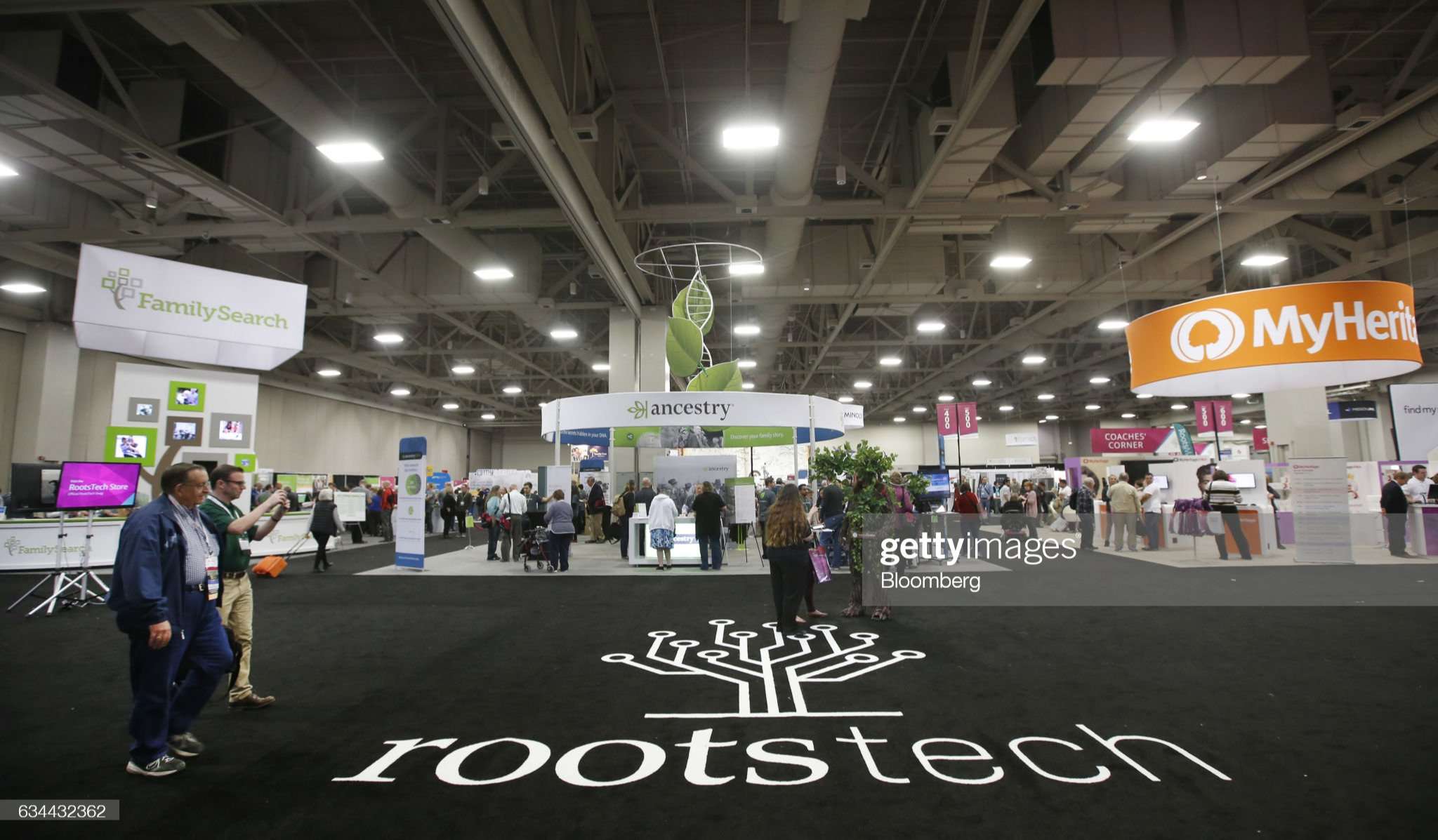 Attendees walk through the exhibition floor of the 2017 RootsTech Conference in Salt Lake City, Utah